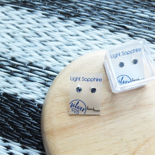 SWA COLL : ROUND LIGHT SAPPHIRE SILVER STUD EARRINGS