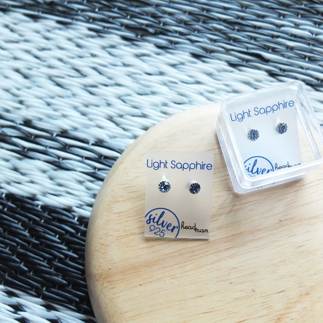 SWA COLL : ROUND LIGHT SAPPHIRE SILVER STUD EARRINGS